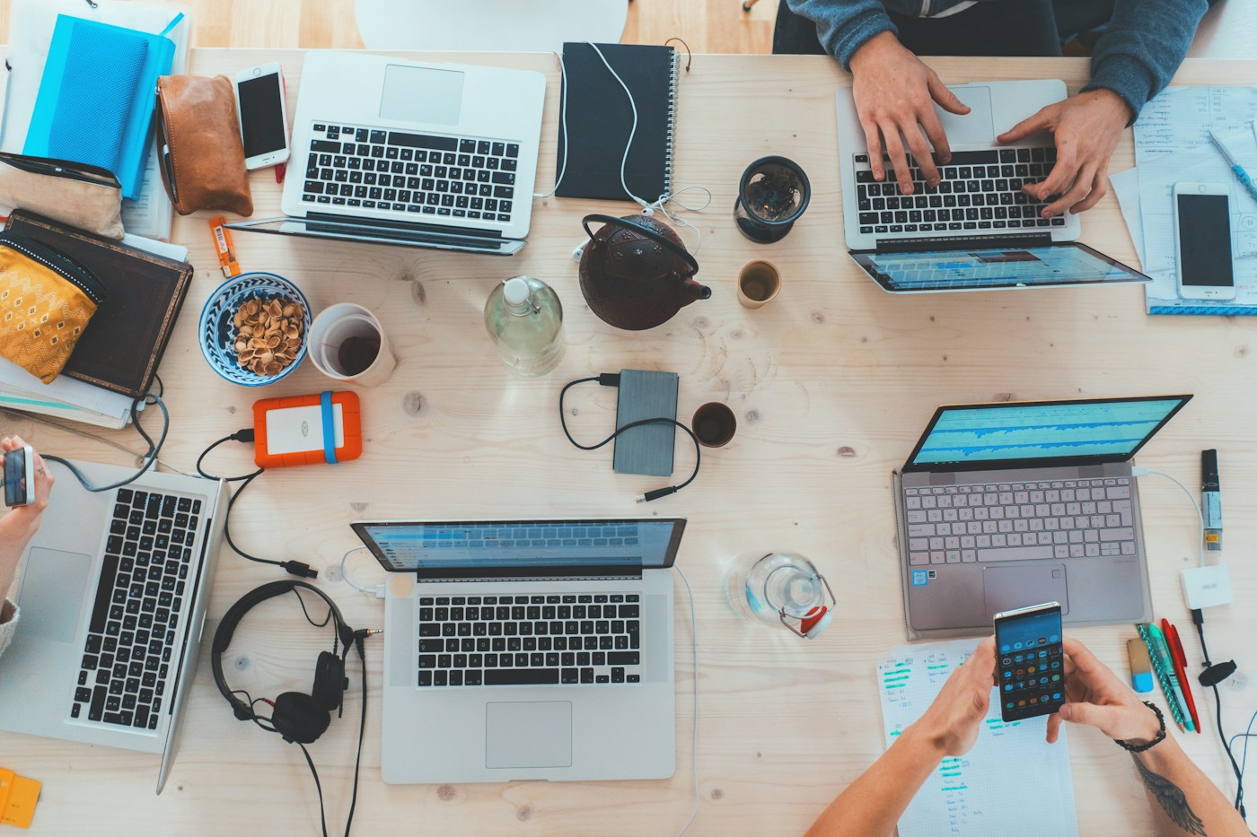 A group working together with computers and notes
